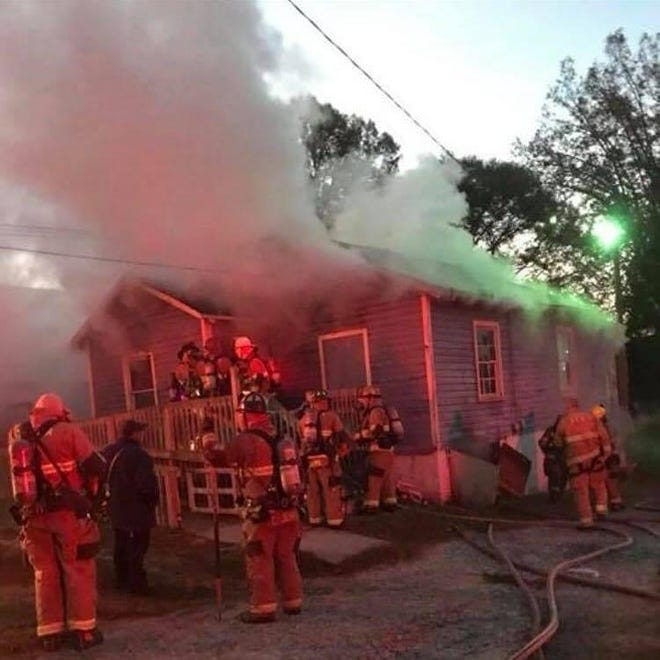 Gastonia firefighters put out a house fire in this Gazette file photo.

[Gaston Gazette file photo]