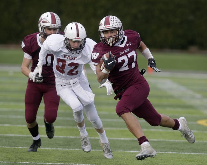 Woonsocket's Emmanuel Gomes gains yardage in the Division II Super Bowl against East Greenwich at Cranston Stadium on Sunday. [The Providence Journal / Kris Craig]