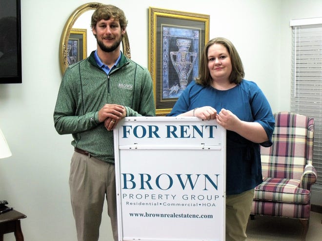 The Brown Property Group provides property management services to single and multifamily homeowners in Fayetteville. Bobby Brown, left, founded the company in 2017. Amanda Butler is the office manager. [Alison Minard for The Fayetteville Observer]