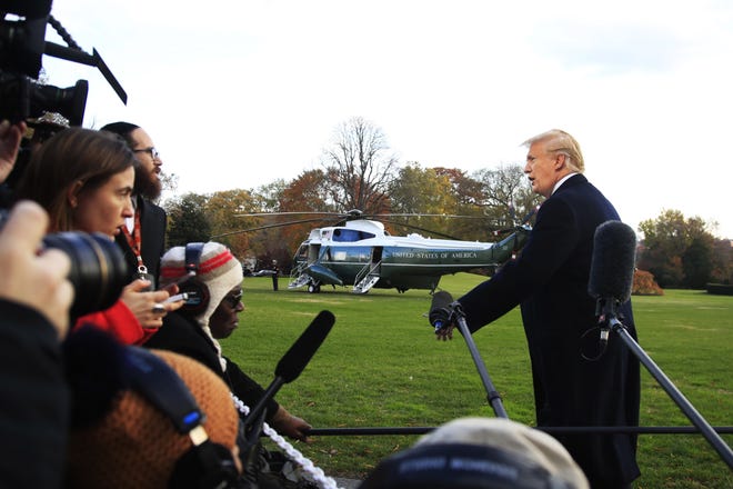 President Donald Trump speaks to the media before leaving the White House in Washington, Tuesday, Nov. 20, 2018, to travel to Florida, where he will spend Thanksgiving at Mar-a-Lago. (AP Photo/Manuel Balce Ceneta)