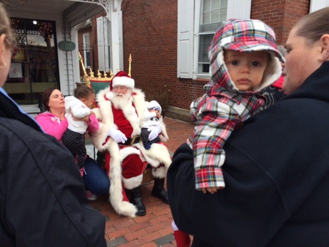 Santa Claus visits Hyannis Main Street on Saturday, Dec. 1 for the annual village stroll. [BP FILE PHOTO]