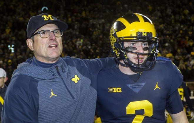 Michigan coach Jim Harbaugh, shown with quarterback Shea Patterson after Saturday's defeat of Indiana, can still be brusque, but he no longer needs attention-seeking antics to create positive optics for his program. [Tony Ding/The Associated Press]
