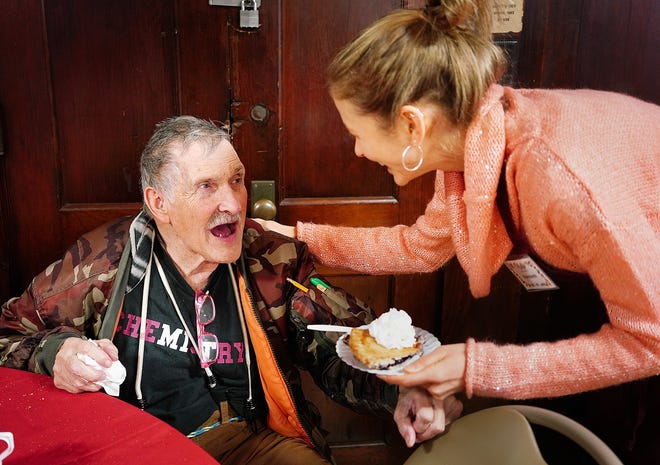 Veteran Roger Hartwell, 79, is served pie by Karabeth Vanick, of Quincy, at the annual Father Bills Thanksgiving Dinner held at Christ Church, in Quincy,Thursday, Nov. 22, 2018. Gary Higgins/The Patriot Ledger