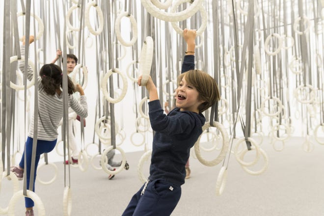 The first room in the exhibit at Boston's Institute of Contemporary Art is filled with 600 hanging white rings that ballet choreographer William Forsythe expects the visitor to use to cross the space, rather than the floor underneath. [Liza Voll]