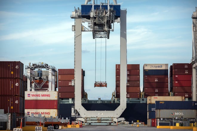 A ship-to-shore crane prepares to load a 40-foot container onto a ship at the Port of Savannah in Savannah, Ga. The synchronized global growth that powered most major economies since 2017 appears to be fading. [AP Archive / 2018]