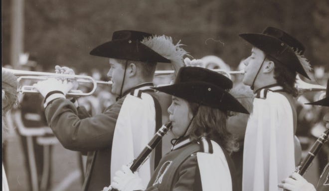 The BHS Marching Band performs during halftime at the Barnstable-Falmouth Thanksgiving football game in 1988 on the occasion of the teams' 100th meeting. [BARNSTABLE PATRIOT FILES/W.B. NICKERSON CAPE COD HISTORY ARCHIVES]