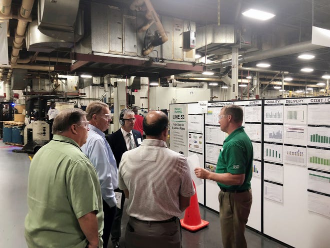 Participants tour the MANN+HUMMEL’s Allen Plant manufacturing facility. [PROVIDED PHOTO]