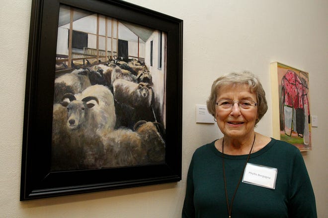 Phyllis Bergagna of Freeport poses next to her work of art entitled "Icelandic Sheep," which won first place in the 15th annual Juried Exhibition at Freeport Art Museum in Freeport. Bergagna was recognized at a reception on Saturday, Nov. 17, 2018, at Freeport Art Museum. [JANE LETHLEAN/THE JOURNAL-STANDARD CORRESPONDENT]