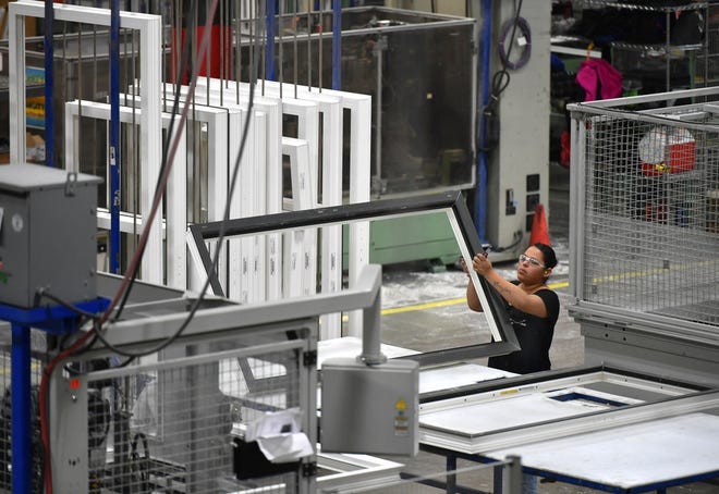 The production floor at PGT Custom Windows and Doors in Venice. [HERALD-TRIBUNE STAFF PHOTO / MIKE LANG]