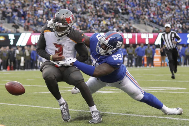 New York Giants' Mario Edwards, right, forces Tampa Bay Buccaneers quarterback Jameis Winston to fumble near the goal line during a game in East Rutherford, N.J. [AP Photo/Julio Cortez]