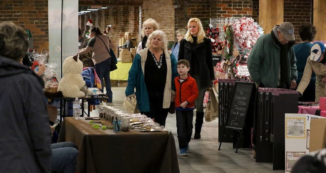 Shoppers make their way through the Small Business Saturday event held at the Loray Mill. [JOHN CLARK/THE GASTON GAZETTE]