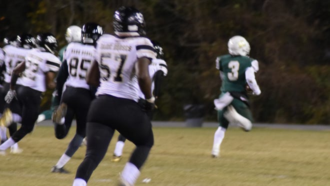 Kinston's Jacel Jacobs (3) runs past Clinton's defense in the second quarter to score a 71-yard touchdown to tie up the game at 7. [Kai Jones / The Free Press]