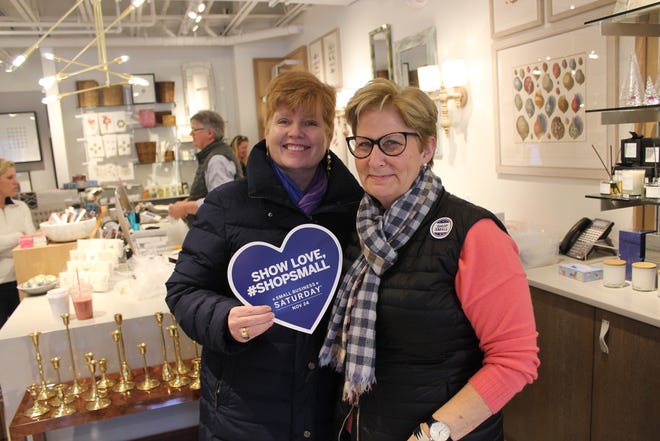 Anne Sadow, right, co-owner of Floral Home in Dartmouth, celebrated Small Business Day Saturday with friend Kashine Dolar. [Steve Urbon/The Standard-Times/SCMG]