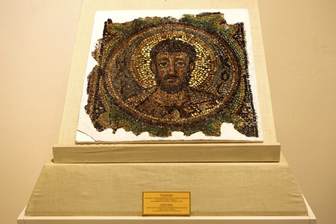 A rare mosaic depicting Saint Mark is displayed at the Byzantine Museum after its return to Cyprus, in Nicosia, Wednesday, Nov. 21, 2018. Like an intricate 1,500 year-old jigsaw puzzle, a rare mosaic depicting Saint Mark will join other repatriated pieces that were looted from a 6th century church in ethnically split CyprusþÄô breakaway Turkish Cypriot north to reconstitute the churchþÄôs apse. (AP Photo/Petros Karadjias)