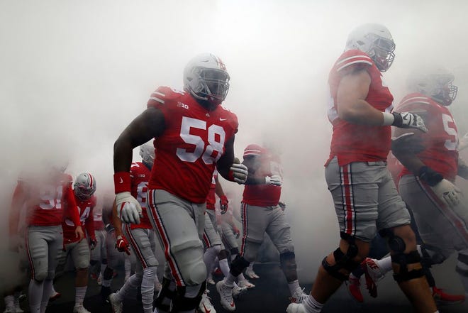 Ohio State Buckeyes offensive lineman Joshua Alabi (58) takes the field prior to the NCAA football game against the Michigan Wolverines at Ohio Stadium in Columbus on Nov. 24, 2018.