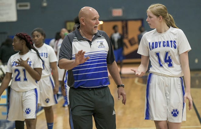 Wildwood coach Richard Hampton talks with Ashtin Ingram (14) at the half of a Lady Cat Tip-Off Classic game against Oviedo Hagerty on Nov. 15 in Wildwood. This will be Hampton's final season coaching the Wildcats. [PAUL RYAN / CORRESPONDENT]
