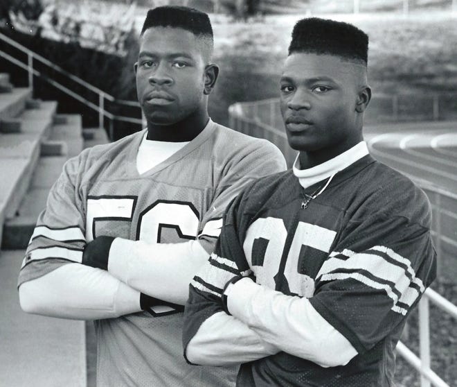 Former Ashbrook standout Sean Boyd (right) and former Hunter Huss standout Greg Black signed football scholarships with North Carolina and coach Mack Brown in February 1991. Brown is expected to be introduced as new UNC head coach on Tuesday. [Gazette file photo]