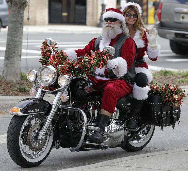 Santa and Mrs. Claus (portrayed by Joe Niles and Cheryl Bilquist), took part in a previous Harley Owners Group (HOG) toy run for underpriviledged children. This year's event will be held Saturday, starting and ending at War Horse Harley-Davidson on North U.S. 441. The event is to provide a fun experience and gifts for children who otherwise might not have such treats during the holiday season. [File]