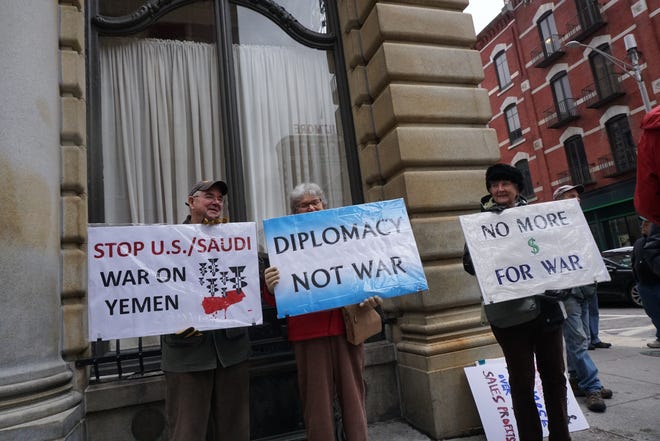Mitch Henderson, of Warren, Bernie Bowdoin, of East Providence, and Nancy Hood, of Bristol, were among the activists who rallied in front of the building that houses Sen. Sheldon Whitehouse's office to demand that he vote for a resolution to end U.S. military involvement in the Saudi war in Yemen. [The Providence Journal / Sandor Bodo]