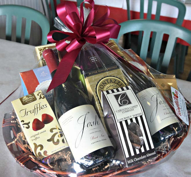 Gift baskets should include a variety of sweet, salty and other items that vary in height and texture, according to gift basket maker Sue Frye at Temptations Gourmet Cafe. [ASHLEY MORRIS/STARNEWS]