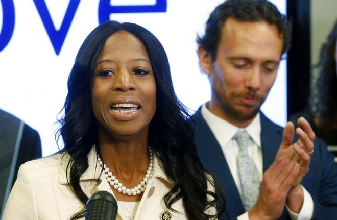 Surrounded by her family, Rep. Mia Love, R-Utah, talks about election results in the 4th Congressional District at the Utah Republican Party headquarters Monday Nov. 26, 2018, in Salt Lake City. (AP Photo/Rick Bowmer)