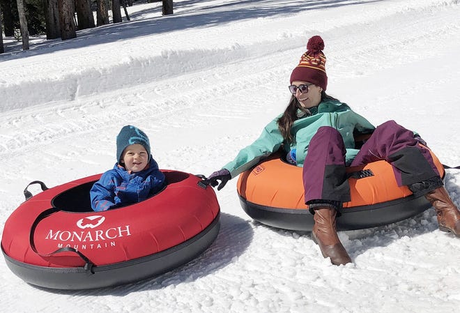 Marten Egbert and his mom Eva give Monarch Mountain's new tubing park a try. The park officially opens Thursday and is the first-of-its-kind in the area. [COURTESY PHOTO]