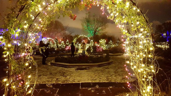 The Rose Garden glows at night with a light snow at Cleveland Botanical Garden's Glow. {Cleveland Botanical Garden]