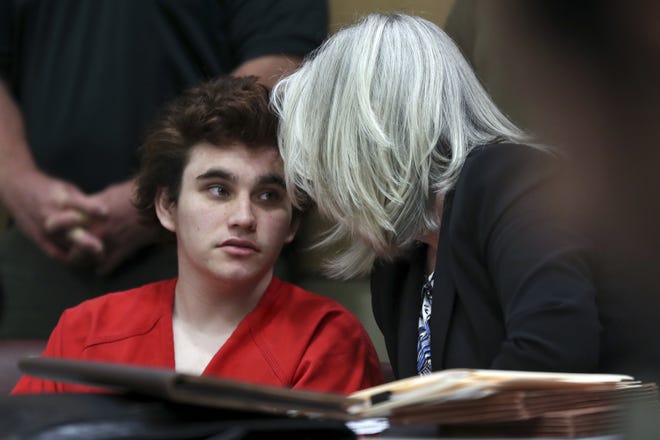 Florida school shooting suspect Nikolas Cruz talks with his defense attorney Diane Cuddihy at the Broward Courthouse in Fort Lauderdale, Fla., Tuesday. Cruz faces the death penalty if convicted of the massacre at Marjory Stoneman Douglas High School. [Amy Beth Bennett/AP Photo]