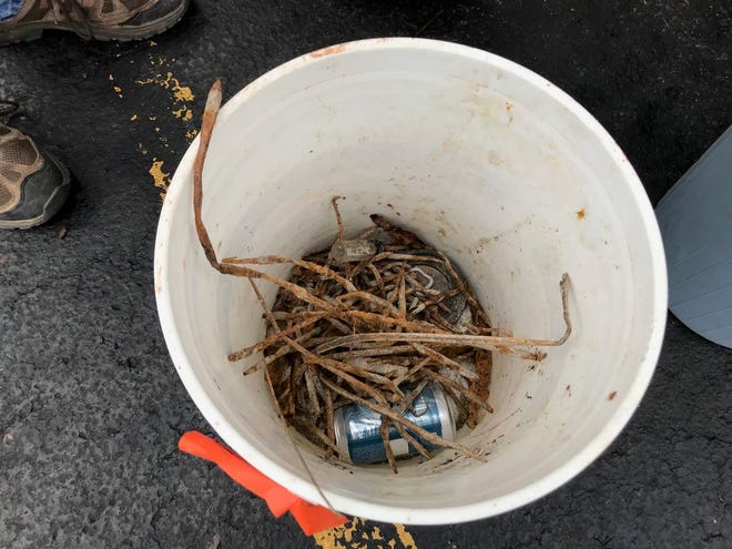 A bucket of metal found by Bill Davis along Milwaukee Rd. in Milan Township is pictured. (Monroe News photo by PAULA WETHINGTON)