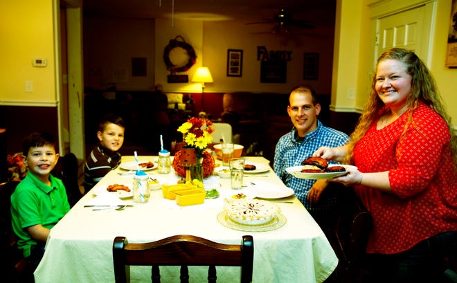 From left, James, Jeremy, Alan and Tiffany Esbenshade enjoy Tiffany's candy acorn squash slices for dinner.