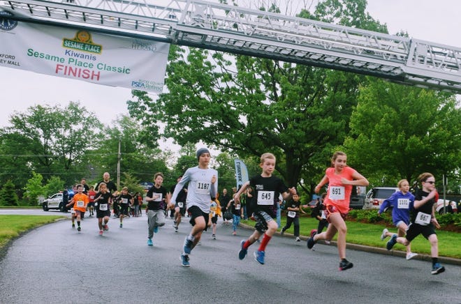 Young competitors participate in the one-mile fun run/walk during the 2018 Sesame Place Classic. [CONTRIBUTED]
