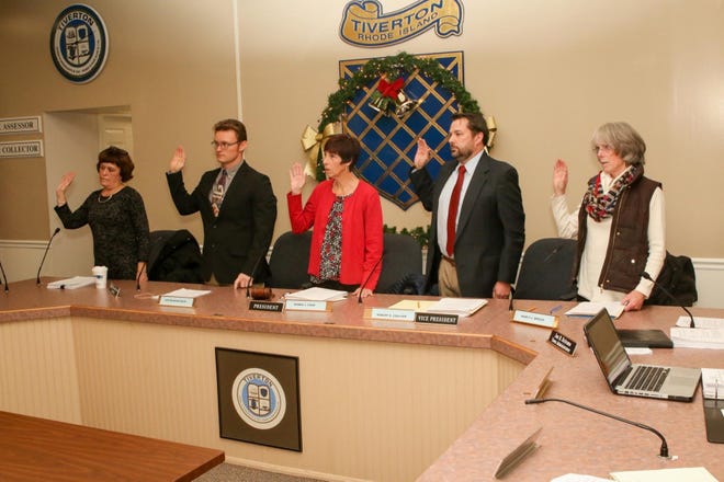 Members of the Tiverton Town Council are sworn-in during a meeting Monday night. [Newport Daily News Photo | Marcia Pobzeznik
]