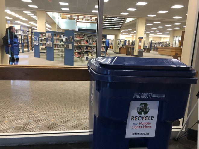 New Hanover County is collecting broken Christmas lights in recycling bins at several locations, including at the public library in downtown Wilmington. [TIM BUCKLAND/STARNEWS]