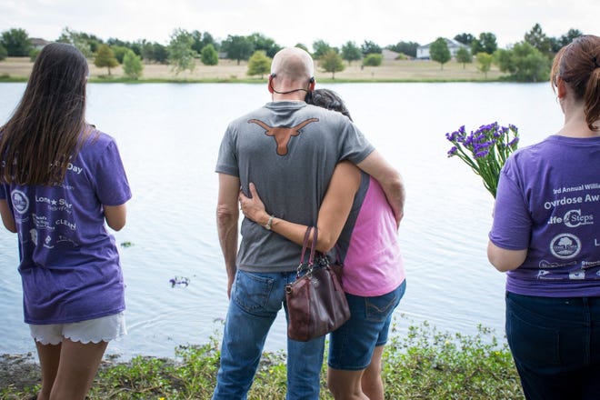 Jeff and Silvana Smith hug at an event at Old Settlers Park in Round Rock in August as they remember her nephew, Erik Majdali, who died from an overdose. [Megumi Rooze / For the American-Statesman]
