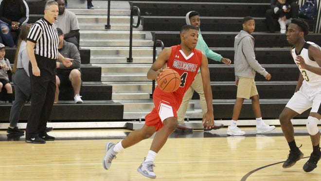 Terrel Brown had 13 points for the Tigers in their 78-60 win over East St. John. Photo by Kyle Riviere.