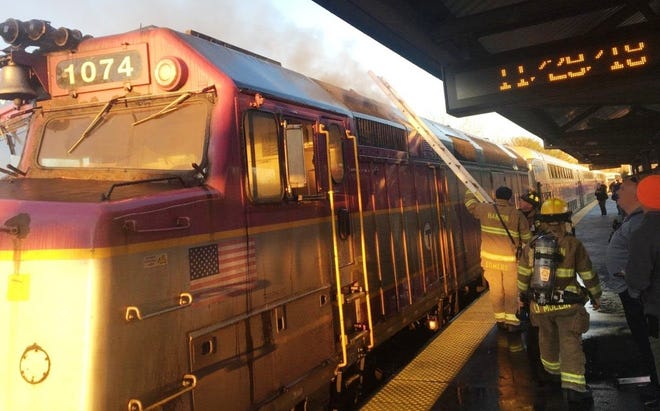 Hanson firefighters work to put out a smoky fire on an MBTA Commuter Rail train in Hanson Thursday morning, Nov. 29, 2018.



(Hanson Police Department)