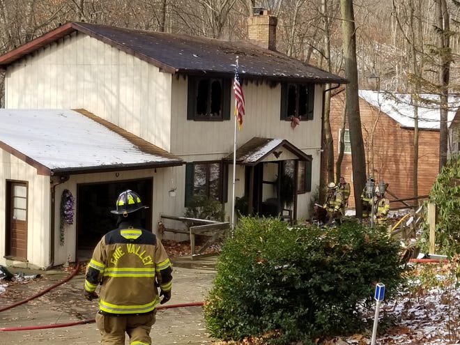 Firefigthers from several departments battled a blaze at 4696 Riverdale St. SW in Bethlehem Township on Thursday monring. A man who was inside at the time suffered smoke inhalation and was taken to a hospital. (IndeOnline.com / Amy L. Knapp)