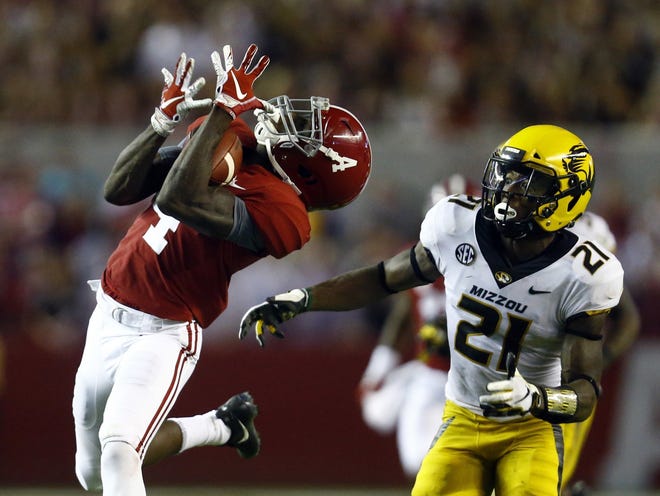 Alabama's Jerry Jeudy catches a pass as Missouri's Christian Holmes defends during the Crimson Tide's win in October. Jeudy has more playmaking company among Alabama's receivers than high-profile predecessors Julio Jones, Amari Cooper or Calvin Ridley. [Butch Dill/The Associated Press]
