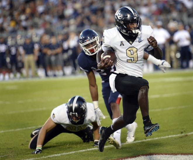 With star QB McKenzie Milton out, UCF will need running back Adrian Killins (9) and others to step up on Saturday against Memphis. [AP File Photo]