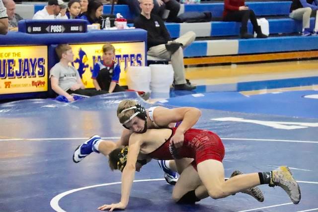 Justin Stammer (152) takes on Eli Thorson from Roland Story at home dual meet on Thursday, Nov. 29, 2018. PHOTO BY LIBBIE RANDALL/THE PERRY CHIEF