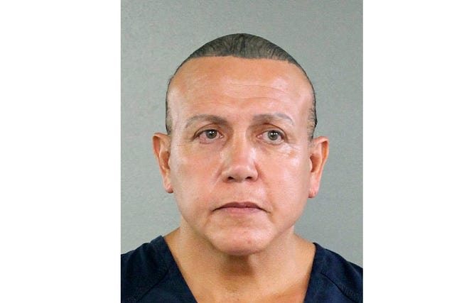 FILE - In this undated photo released by the Broward County Sheriff's office, Cesar Sayoc is seen in a booking photo, in Miami. A police report says mail pipe bomb suspect Cesar Sayoc was accused earlier in 2018, with throwing urine from his van at two women on a moped in Florida. The Hollywood Police Department report says Sayoc pulled up near the moped, began yelling obscenities and tossed two vials of urine at the women. The first missed, but the second one drenched one of them. (Broward County Sheriff's Office via AP)