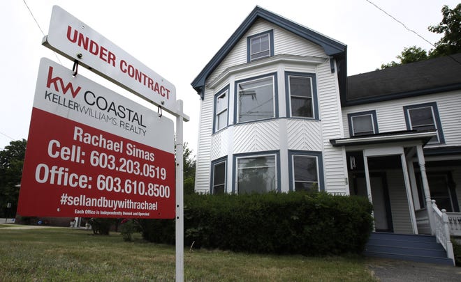 In this June file photo, an "Under Contract" sign is displayed in front of home for sale in Raymond, N.H. Pending home sales in the U.S. fell 2.6 percent in October. [Associated Press/Charles Krupa]