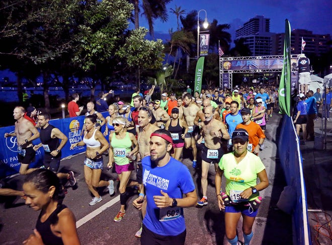 Runners start the Palm Beach Marathon along Flagler Drive in downtown West Palm Beach in, 2015. [Richard Graulich / Daily News file photo]