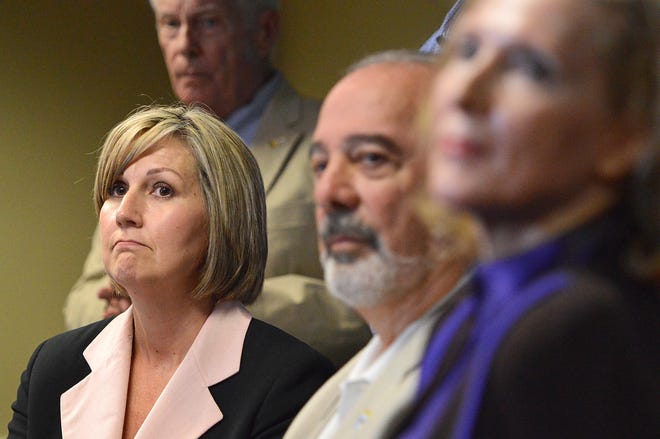 Sherry Sutphen, left, attorney for the city of Mount Dora, answers a question as Mayor Nick Girone and homeowner Nancy Nemhauser listen at a press conference about the Starry Night settlement on Wednesday, July 18, 2018, at Mount Dora City Hall. [WhitneyLehnecker/Daily Commercial]