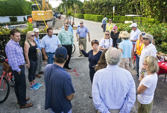 Town Engineer Patricia Strayer, center, addresses residents gathered at Annie's Dock, by the intersection of North Ocean Boulevard and East Inlet Drive, where the town held a special meeting in November 2017 to inform residents about the underground utilities project. [Lannis Waters / Daily News]