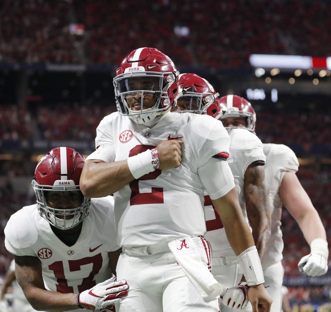 Alabama quarterback Jalen Hurts (2) came off the bench to lead a comeback victory over Georgia on Saturday in the SEC championship game. The Tide will meet Oklahoma in the Cotton Bowl. [John Bazemore/The Associated Press]