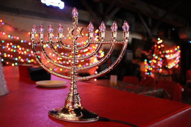 A Hanukkah menorah takes a prominent place among all the Christmas trees and lights at Donn's Depot.