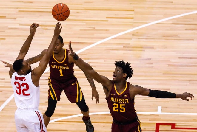 Minnesota Golden Gophers Daniel Oturu (25) attempts to block a shot by Ohio State Buckeyes Keyshawn Woods (32) in the first half of the NCAA basketball game between the Ohio State Buckeyes and the Minnesota Golden Gophers at Value City Arena on Sunday, Dec. 2, 2018.