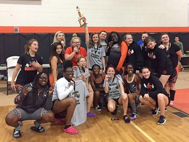 Leesburg High School weightlifters celebrate on Saturday after winning the team championship at the Leesburg Liftsgiving Invitational in the Leesburg gym. [SUBMITTED]