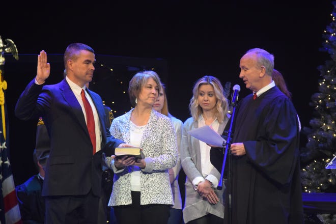 Davidson County Sheriff Richie Simmons was sowrn into office by North Carolina Supreme Court Justice Paul Newby Monday morning at his home church in Thomasville. Simmons' wife and family looked on. [Elizabeth Pattman/The Dispatch]